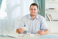 man with receipts in hand