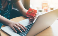 lady on laptop with small gift