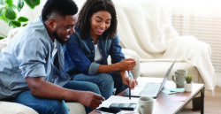 Young couples looking at laptop