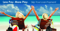 couple in beach lounge chairs by ocean