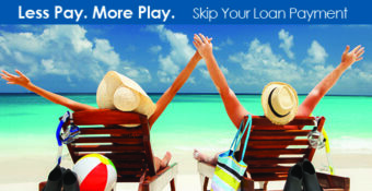 couple in beach lounge chairs by ocean