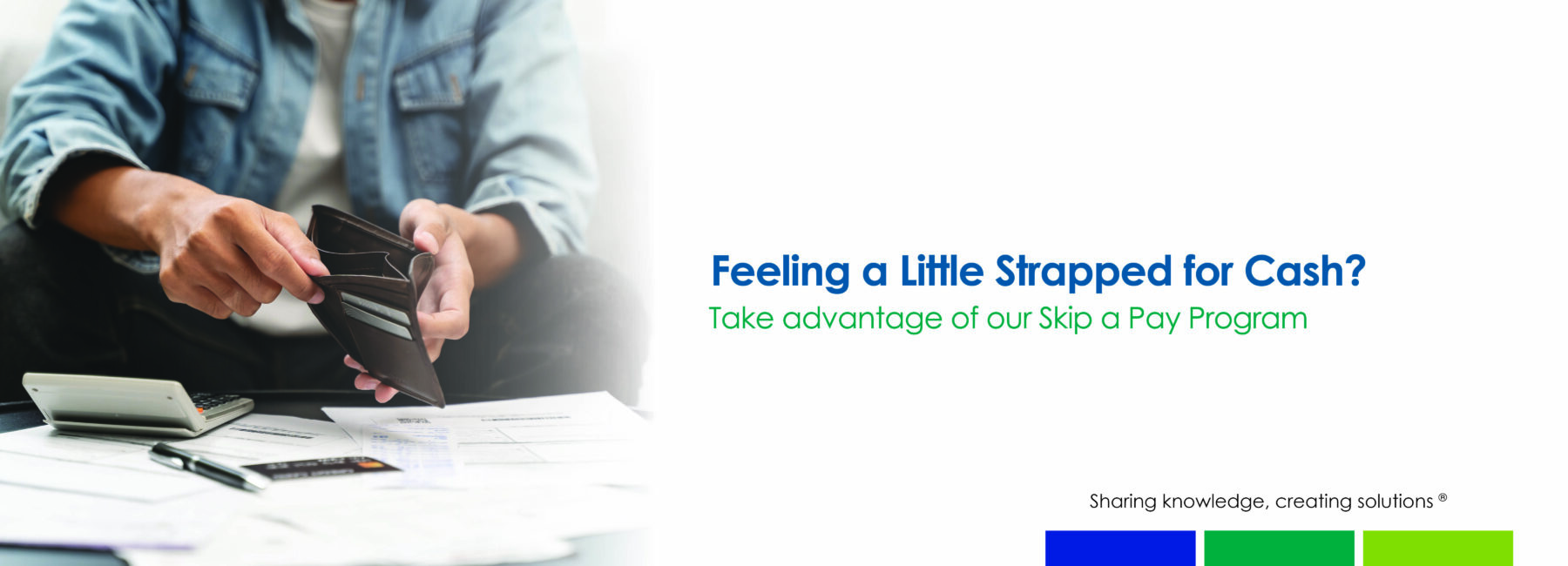 male holding empty wallet near stack of bills